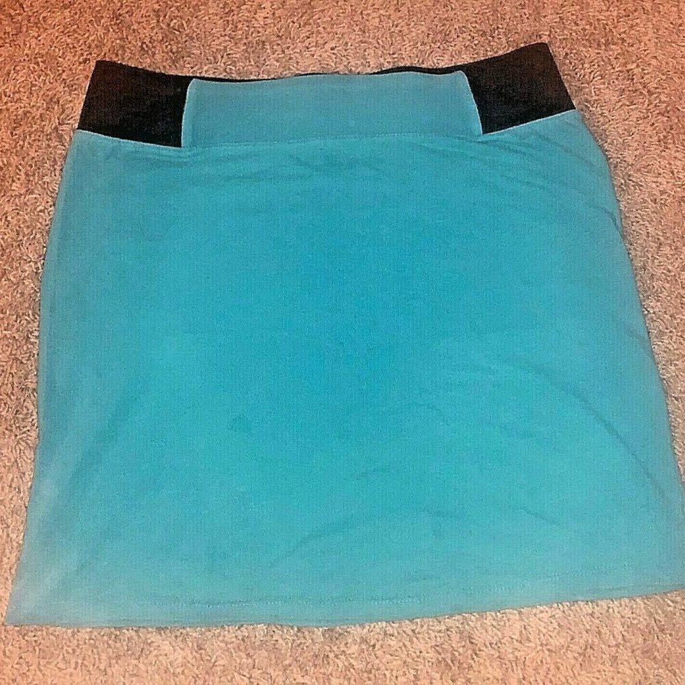 Large Teal, Tight, Stretch Skirt with Black Waist Band. Knee-length to Mini
